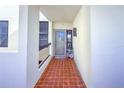 Condo entry with tiled floor and view to living room at 1930 Harbourside Dr # 152, Longboat Key, FL 34228