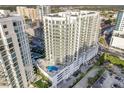 Aerial view of a modern highrise building in a city setting at 301 Quay Commons # 1111, Sarasota, FL 34236