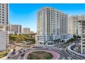 Aerial view of a modern highrise building near a roundabout at 301 Quay Commons # 1111, Sarasota, FL 34236