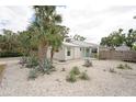 White single story home with palm trees and xeriscaping at 323 Villanova Rd, Venice, FL 34293