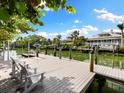 Private waterfront dock with seating, perfect for enjoying the waterfront views at 3460 Flamingo Ave, Sarasota, FL 34242