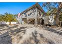 Two-story house with carport and spacious driveway at 3511 Camino Real, Sarasota, FL 34239