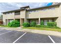 Townhouse building with landscaping and parking at 4477 Sandner Dr, Sarasota, FL 34243