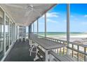 Relaxing balcony with ocean views and seating area, perfect for enjoying the sunset at 6300 Midnight Pass Rd # 606, Sarasota, FL 34242