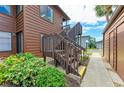 Wooden stairs leading to condo entrance, well-maintained at 7135 27Th W Ave # 7135, Bradenton, FL 34209