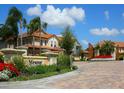 Gated community entrance with landscaping and signage at 8133 Miramar Way # 201, Lakewood Ranch, FL 34202
