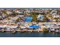 Aerial view of canal-front homes and neighborhood at 19 Seaside Ct, Holmes Beach, FL 34217