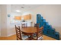 Charming dining area with a round table and chairs, adjacent to the kitchen at 4209 Cascade Falls Dr, Sarasota, FL 34243