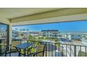 Cozy balcony seating offers serene views of the neighborhood and a relaxing outdoor space at 601 Gulf N Dr # 209, Bradenton Beach, FL 34217