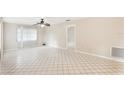 Spacious living room with tile flooring and a ceiling fan at 7145 Bright Creek Dr # 33, Sarasota, FL 34231