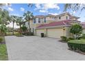 Two-story townhome with double garage and manicured landscaping at 918 River Basin Ct # 101A, Bradenton, FL 34212