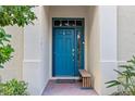 Inviting teal front door with a small bench and brick walkway at 918 River Basin Ct # 101A, Bradenton, FL 34212
