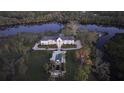Luxury waterfront home with pool and expansive landscaping at 1245 Mill Creek Rd, Bradenton, FL 34212