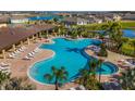 Resort-style pool with plenty of lounge chairs and a large deck at 17921 Canopy Pl, Bradenton, FL 34211