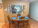 Cozy dining area with stained glass window and hardwood floors at 390 301 W Blvd # 30B, Bradenton, FL 34205