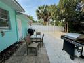 Small patio with table, chairs, and grill at 5026 Calle Minorga, Sarasota, FL 34242