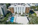 Aerial view of a modern building with a refreshing pool area at 711 S Palm Ave # 203, Sarasota, FL 34236