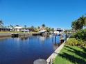 View of a peaceful canal with boats docked along the waterway at 1732 Boca Raton Ct, Punta Gorda, FL 33950