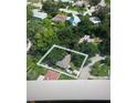 An aerial view showing the property, neighboring houses, and surrounding trees at 2141 Clematis St, Sarasota, FL 34239