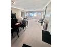 Open-concept living and dining area with large windows, providing ample natural light at 2141 Clematis St, Sarasota, FL 34239