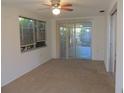 Bright Florida room with sliding glass doors leading to a patio at 3245 Roxbury Dr, Holiday, FL 34691