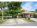 Inviting two-story home with carport and mature landscaping, offering shade and curb appeal at 3415 51St Avenue W Cir # 206, Bradenton, FL 34210