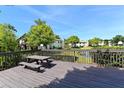 Community deck with picnic table overlooking a pond at 3609 59Th W Ave # 4045, Bradenton, FL 34210