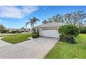 One-story house with a circular driveway and a large front yard at 7153 Drewrys Blf, Bradenton, FL 34203