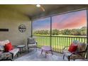 Relaxing lanai overlooking a lush golf course at 13828 Messina Loop # 204, Lakewood Ranch, FL 34211