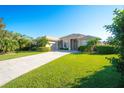 Two-story house with a large driveway and nicely manicured lawn at 4911 96Th St E, Bradenton, FL 34211