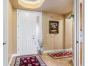 Bright condo entryway with tile floors and a white door at 5209 Manorwood Dr # 3A, Sarasota, FL 34235
