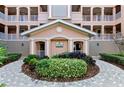 Circular walkway leading to the condo building entrance at 5209 Manorwood Dr # 3A, Sarasota, FL 34235
