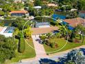 Aerial view of single-Gathering home with pool and canal access at 5537 Cape Leyte Dr, Sarasota, FL 34242