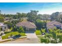 One-story house with a tile roof, located in a residential neighborhood at 5868 Meriwether Pl, Sarasota, FL 34232