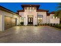Evening view of home's entrance and garage at 9224 Starry Night Ave, Sarasota, FL 34241
