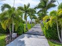 Private gated entrance with lush landscaping at 931 Bayshore Rd, Nokomis, FL 34275