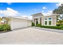 Three-car garage and paver driveway at 931 Bayshore Rd, Nokomis, FL 34275