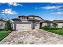 Two-story home with a three-car garage and landscaped yard at 10739 Spring Tide Way, Parrish, FL 34219