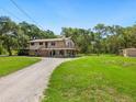 Ranch style home with a large yard and detached shed at 1223 Mill Creek Rd, Bradenton, FL 34212