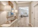 Bright entryway with a console table and mirrors reflecting light at 14924 Sora Way, Bradenton, FL 34212