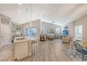 Open floor plan with a kitchen, living area, and dining space at 14924 Sora Way, Bradenton, FL 34212