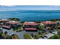 Waterfront condo complex showcasing multiple buildings and parking at 3420 Wild Oak Bay Blvd # 118, Bradenton, FL 34210