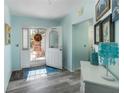 Inviting entryway featuring a welcoming door and decorative elements at 3792 Village Ave, North Port, FL 34291