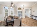 Bright dining room with hardwood floors and a large table at 7448 39Th E Ct, Sarasota, FL 34243