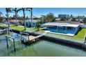 Waterfront property boasts a private pool, dock, and amazing canal views at 8 Island Dr, Treasure Island, FL 33706