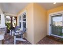 Inviting front porch with two chairs and a small table at 11822 Forest Park Cir, Bradenton, FL 34211