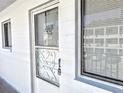 Condo unit entry with a security door and window at 2228 Canal Dr # D26, Bradenton, FL 34207