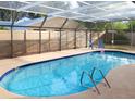 Inviting kidney-shaped pool with a screened enclosure at 3405 Highland W Ave, Bradenton, FL 34205