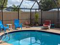 Relaxing screened-in pool area with comfortable seating at 3405 Highland W Ave, Bradenton, FL 34205