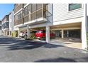 Covered parking spaces for residents with additional storage at 3601 E Bay Dr # 203, Holmes Beach, FL 34217